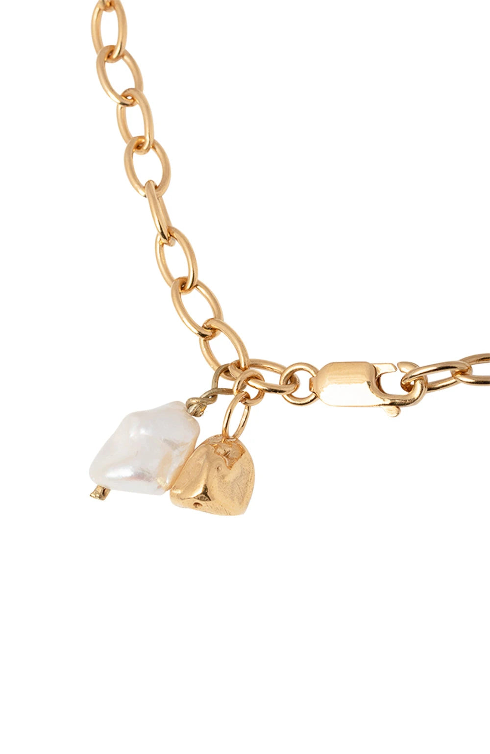 A delicate gold anklet with a fine chain and two gemstone charms, displayed against a soft cream background.